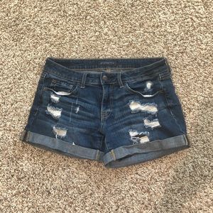 Jean shorts with rips.